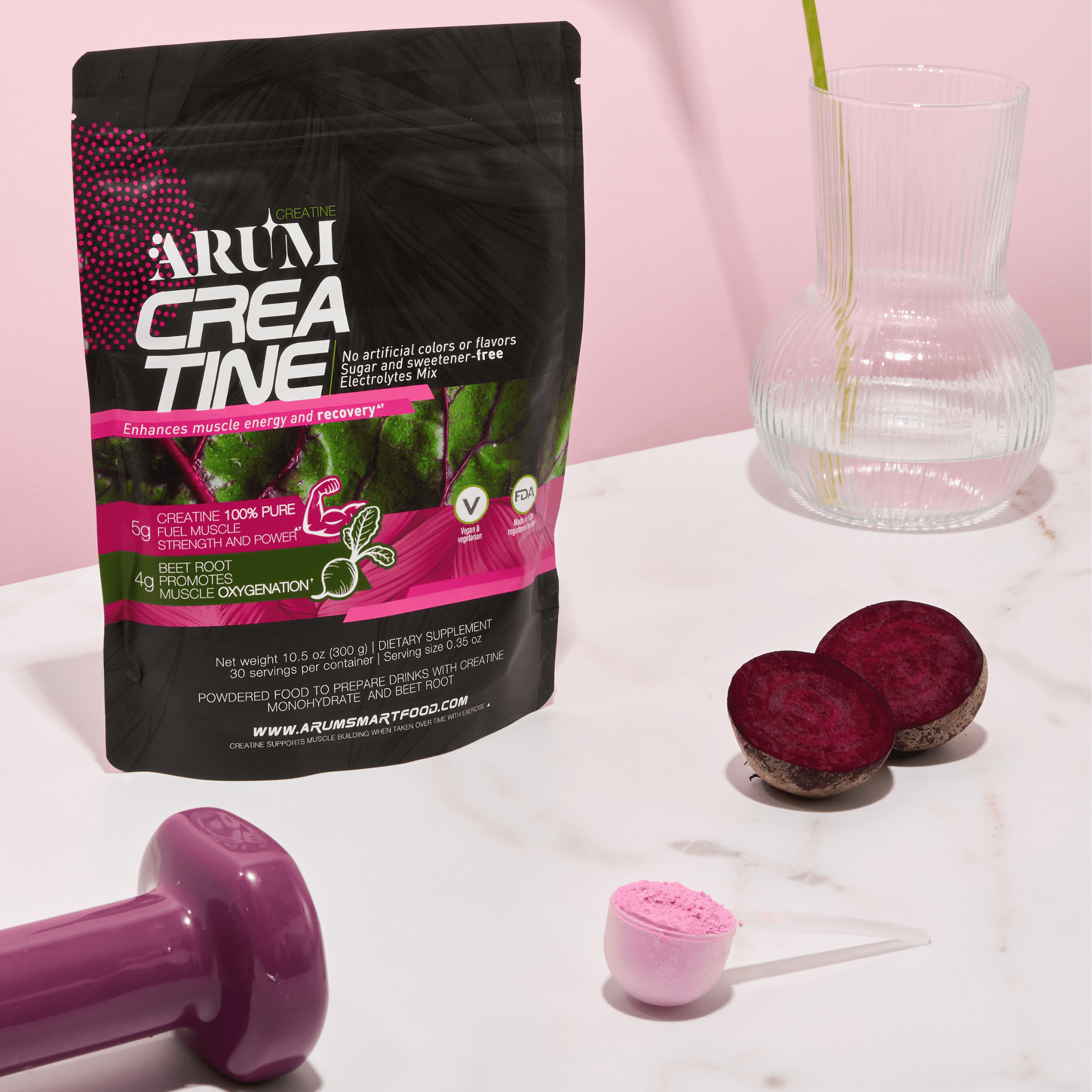 Creatine supplement, dumbbell, beets, and glass.