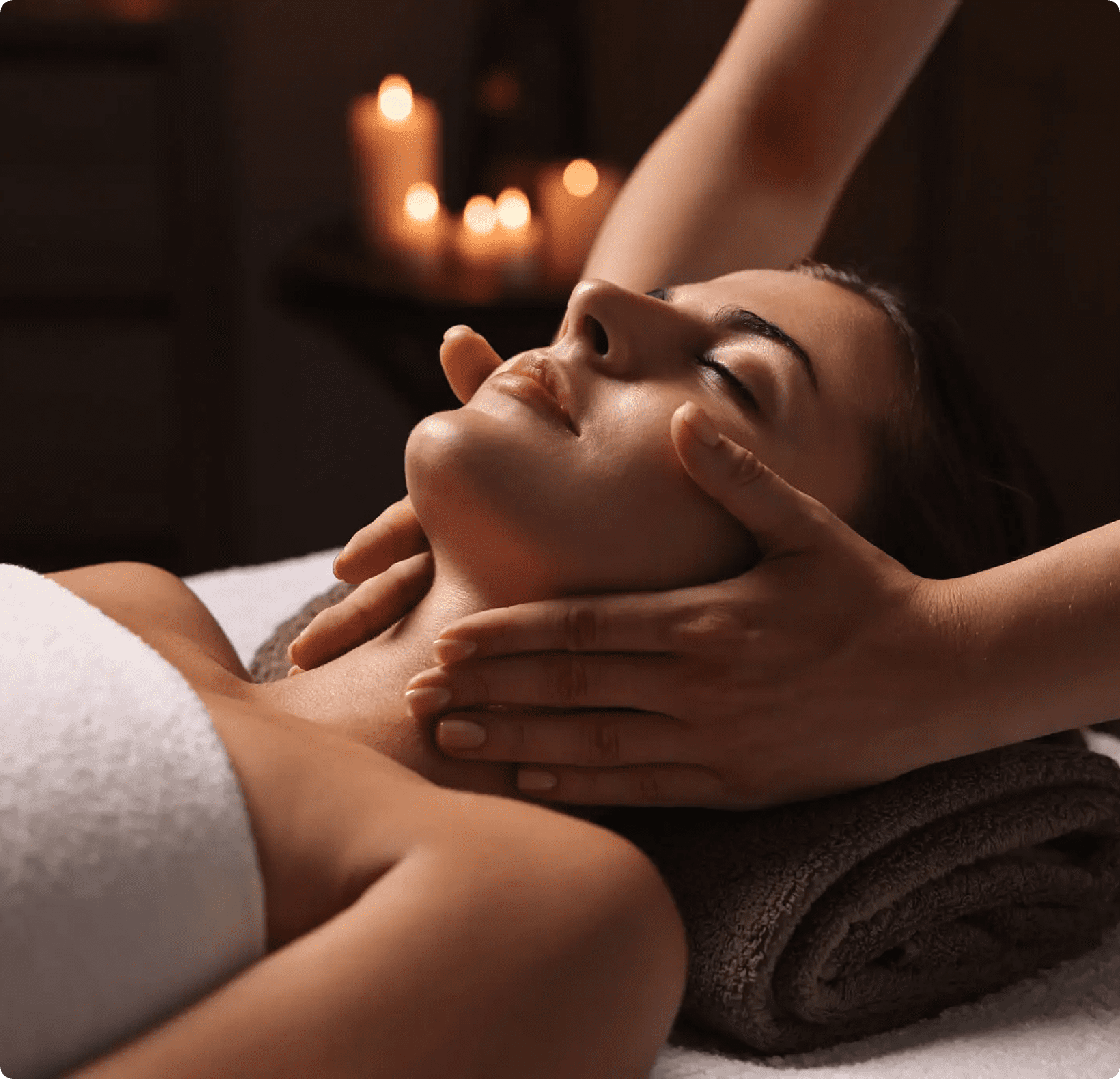 Relaxing facial spa massage, candlelit ambiance