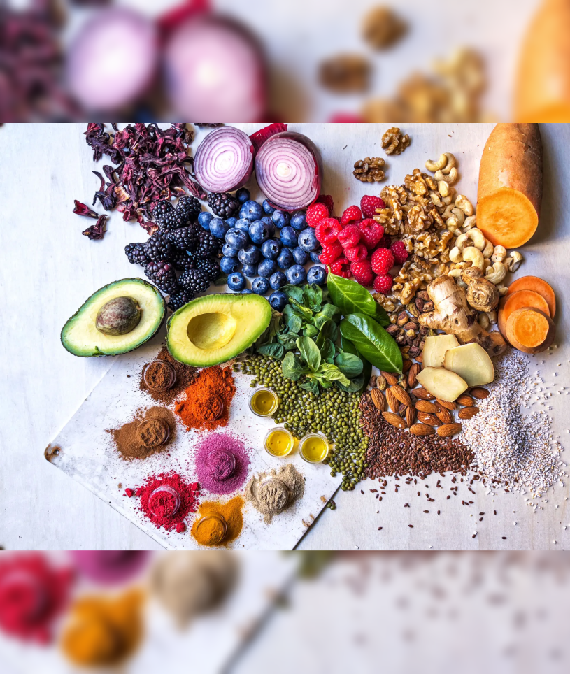 Colorful spread of avocado, berries, nuts, spices