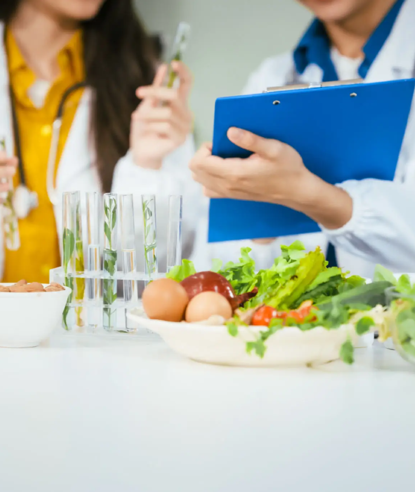 Nutritionists assessing fresh produce and records